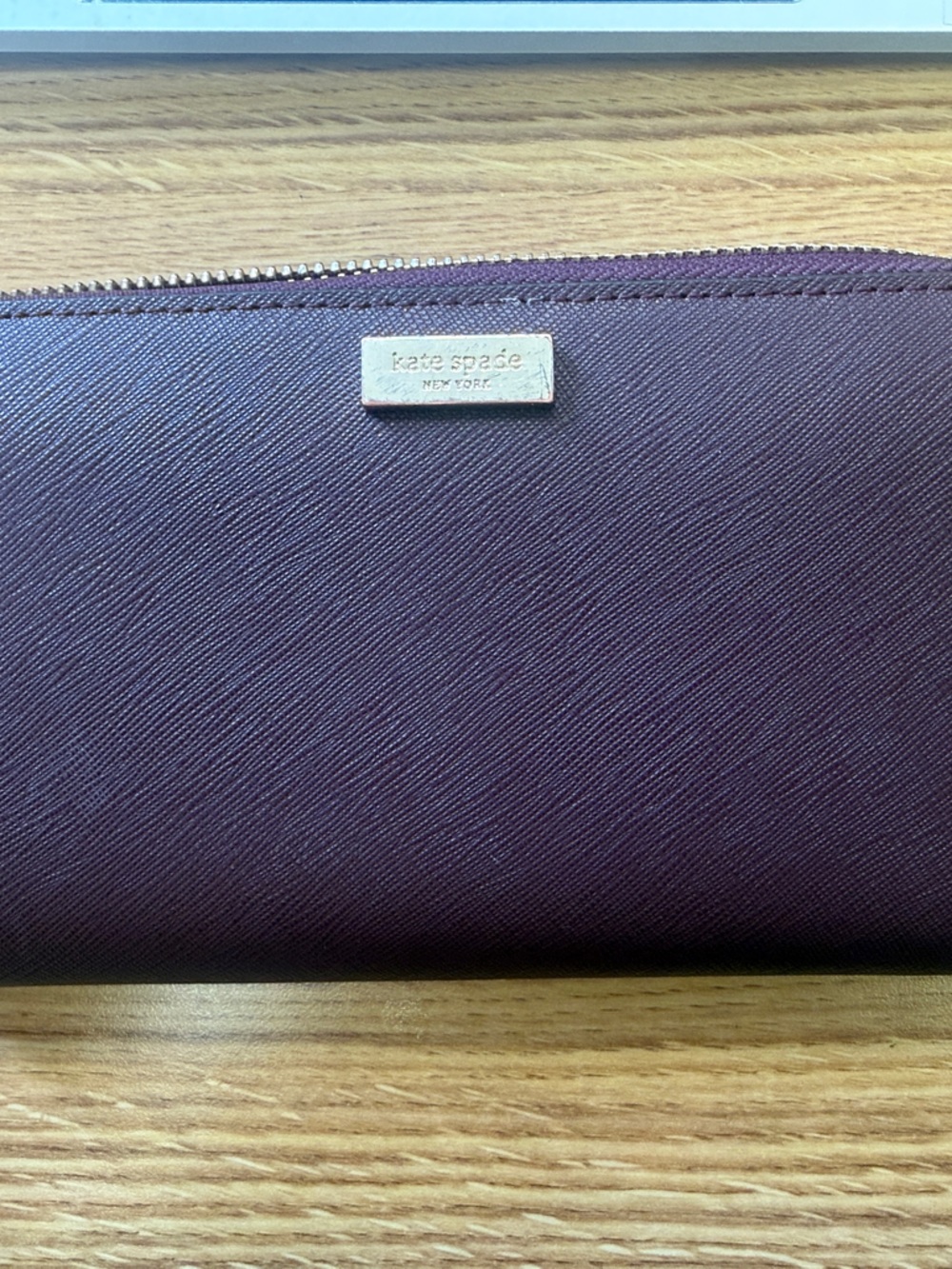 kate spade deep plum zip-around Saffiano wallet